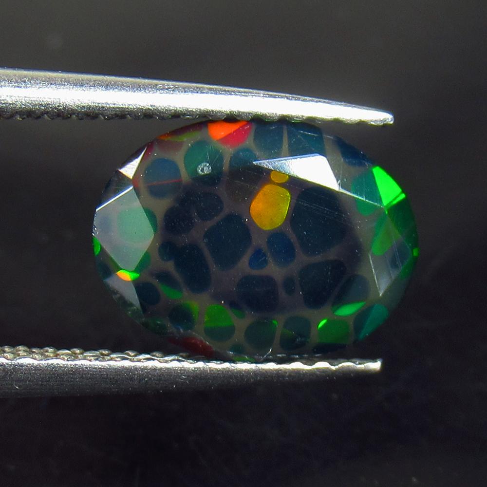 1.21 Ctw Natural Ethiopian Black Fire Opal Oval Cut: No Reserve! Title: 1.21 Ctw Natural Ethiopian Black Fire Opal Oval Cut Stone Clarity: Opaque Gemstones: Natural Black Opal Carat Weights: 1.21 Size/Dimensions: 10.00 x 8.30 x 3.70 mm Additional Inform