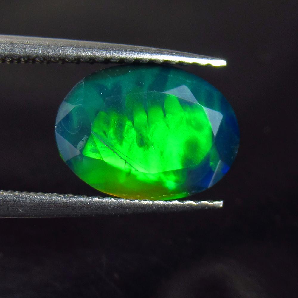 2.60 Ctw Natural Ethiopian Black Fire Opal Oval Cab: No Reserve! Title: 2.60 Ctw Natural Ethiopian Black Fire Opal Oval Cab Stone Clarity: Opaque Gemstones: Natural Black Opal Carat Weights: 2.6 Size/Dimensions: 12.00 x 8.00 x 5.30 mm Additional Informa