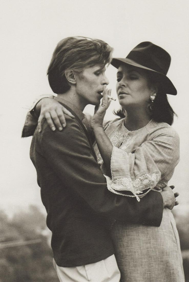 TERRY O’NEILL - David Bowie and Elizabeth Taylor, Beverly Hills, CA, 1975: Artist: TERRY O’NEILL Print Title: David Bowie and Elizabeth Taylor, meeting first time, Beverly Hills, CA, 1975 Printing Date: 1980’s Medium: photo-lithograph Printed in: Italy Image Size