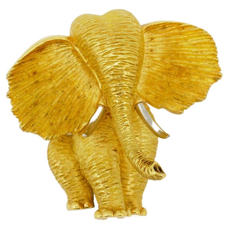 Henry Dunay Yellow Gold Platinum Elephant Brooch: DESIGNER: Henry Dunay; CIRCA: 2000; MATERIALS: 18k Yellow Gold, Platinum; WEIGHT: 41 grams; MEASUREMENTS: 1.75" H x 1.75" W; HALLMARKS: Stamped with Henry Dunay maker's mark, a serial number and the h