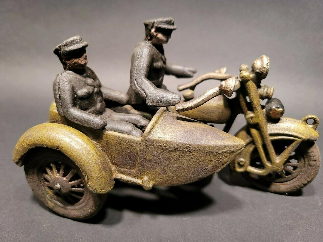 Cast Iron Toy Motorcycle Police Patrol w Side Car: 8 1/2" Long x 4" Wide Such a neat reproduction cast iron motorcycle! As you can see this heavy cast iron pull toy motorcycle was wonderfully hand painted and distressed to look like an original antiqu