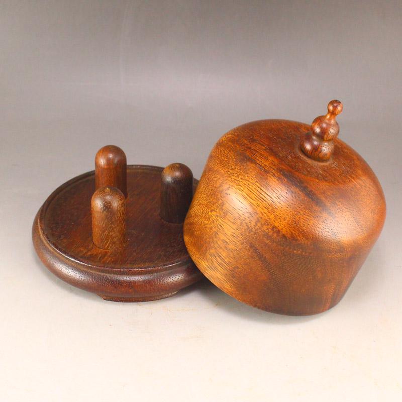 Hainan Huanghuali Wood Thumb Ring Box: Title: Hainan Huanghuali Wood Thumb Ring Box Date Period: After 1910 Origin: Chinese Materials: Wood Dimensions: 122 x 110 (mm) 4.8 x 4.33 (inches)Weight: 0.75 lbs/338 g Additional Information: Reserv