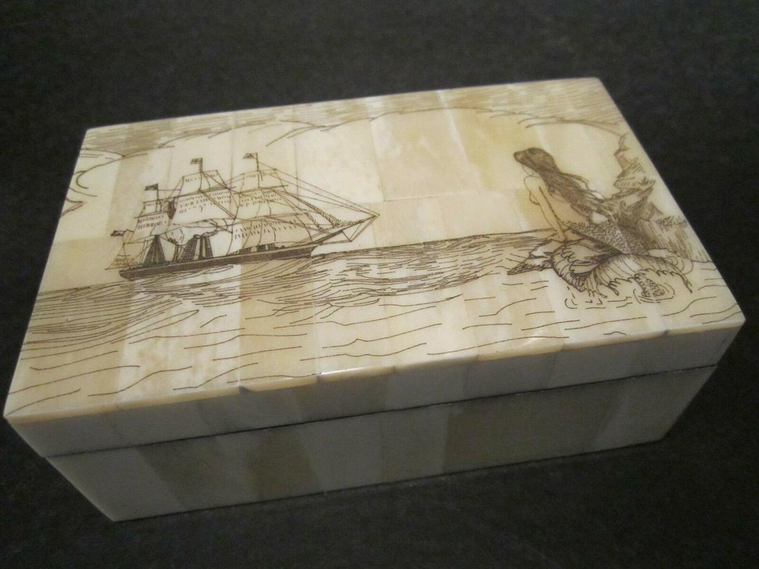 Folk Art Mermaid Scrimshaw Etched Bone & Wood Trinket Box: 6 3/8" Long x 3 7/8" Wide x 1 5/8" High Wonderful new reproduction scrimshaw carved ox bone box. As you can see this piece is tiled with bone on wood and decorated with a design typical of the period.