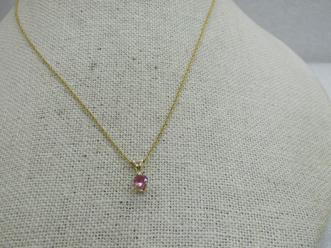 Vintage 14kt Pink Spinel & Clear Topaz Necklace, 20", 1.5 gr.: Vintage 14kt Pink Spinel & Clear Topaz Necklace, 20", 1.53 grams The pink stone tests as spinel. There are a few bubble-like inclusions with a small carbon inclusion. The stone is appx. 3.7mm and appx