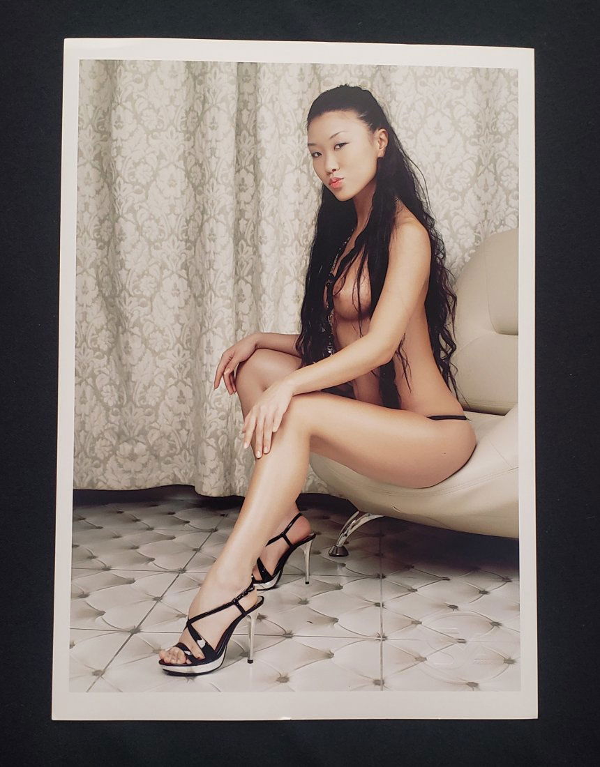 Color Photo Of The Semi Nude Of An Asian Girl