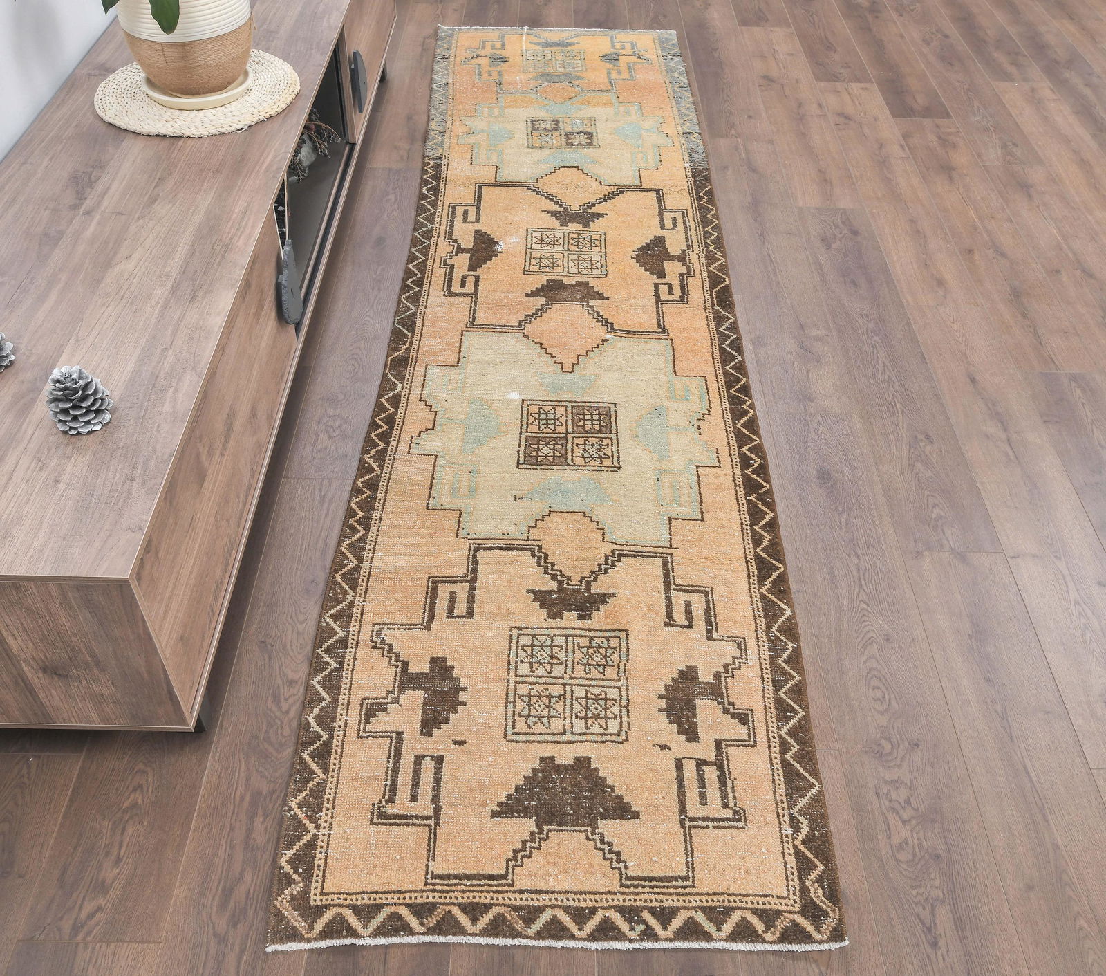 3x10 Turkish Antique Runner: Title: 3x10 Turkish Antique Runner Date/Period: 1960 - 1970 Origin: Turkey Dimension: Length: 9.9 feet Width: 2.6 feet Materials: Wool and Cotton Provenance: This Turkish one-of-a-kind Vintage Rug is