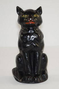 Antique Sitting Black Cat Cast Iron Doorstop: Title: Antique Sitting Black Cat Cast Iron Doorstop Additional Information: Superb casting of a Sitting Cat cast iron Doorstop. Wonderful paint &#8211; done in black with green eyes, red mouth, and wh