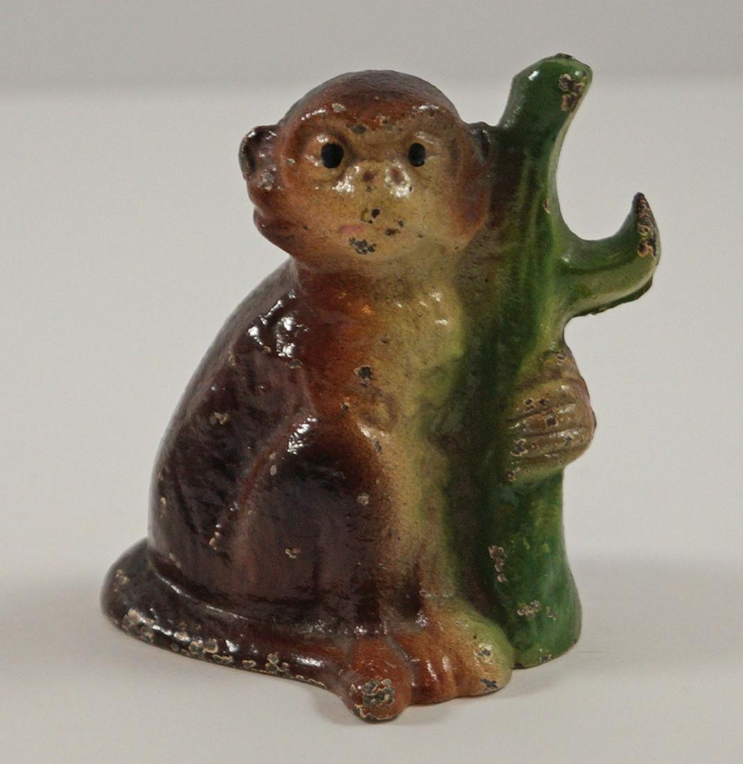 Monkey by Branch Cast Iron Bottle Opener 1947: Title: Monkey by Branch Cast Iron Bottle Opener 1947 Additional Information: Monkey by Branch cast iron Vintage Bottle Opener. Rarer paint variation in brown. Made by John Wright. Date/Period: Ca. 194