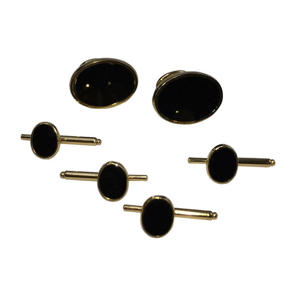 Pierre Cardin Gold and Onyx Cuff Links and Stud Set: Oval 18K gold-plated costume metal cuff links set with simulated black onyx enamel. Marked: "Pierre Cardin ." Dimensions: 0.47" W x 0.83" H Reserve: $238.00 Shipping: Domestic: Flat-rate of $8.30 to a