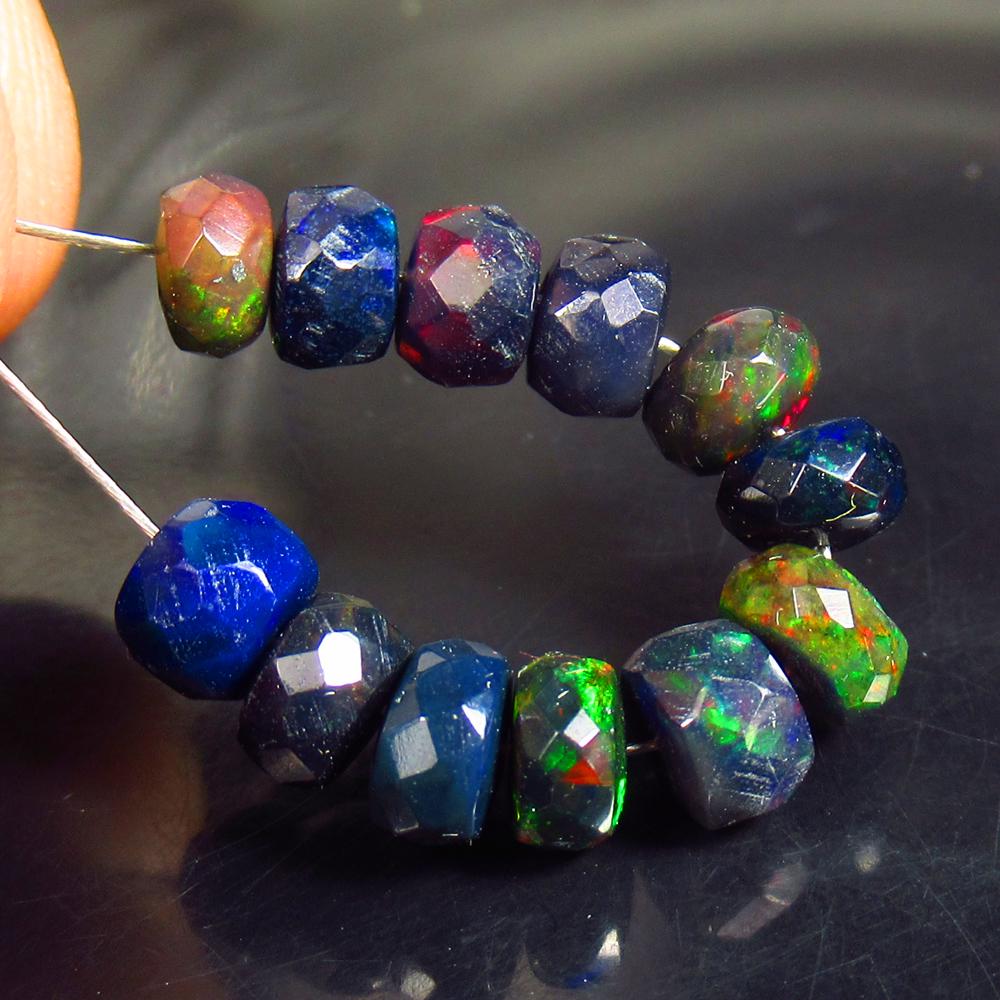 5.53 Ctw Natural 12 Drilled Black Faceted Fire Opal Beads: No Reserve! Title: 5.53 Ctw Natural 12 Drilled Black Faceted Fire Opal Beads Stone Clarity: Translucent Gemstones: Natural Faceted BlackOpal Beads Carat Weights: 5.53 Size/Dimensions: 4.70 to 5.40 mm 