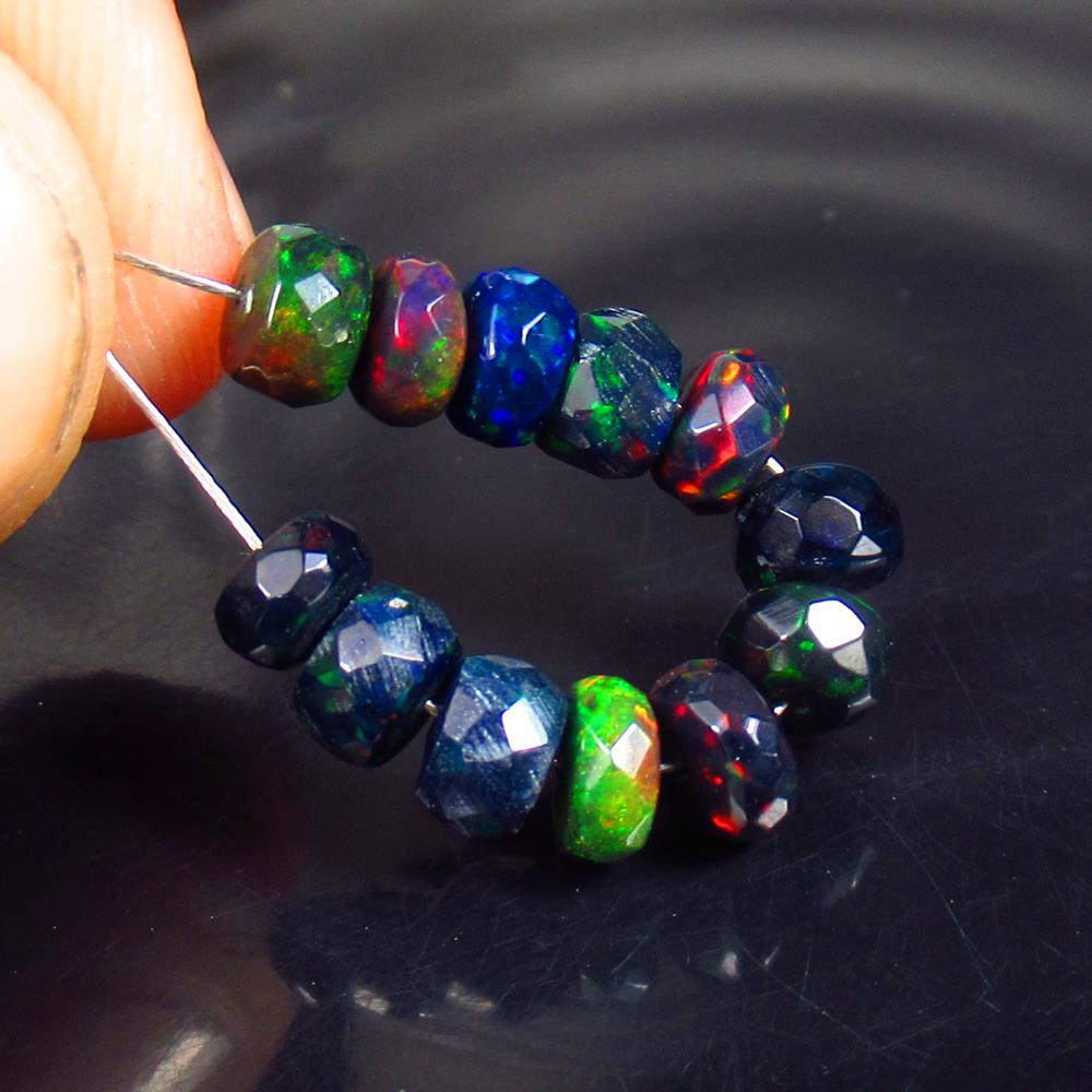 5.54 Ctw Natural 12 Drilled Black Faceted Fire Opal Beads: No Reserve! Title: 5.54 Ctw Natural 12 Drilled Black Faceted Fire Opal Beads Stone Clarity: Translucent Gemstones: Natural Faceted BlackOpal Beads Carat Weights: 5.54 Size/Dimensions: 4.80 to 5.40 mm 