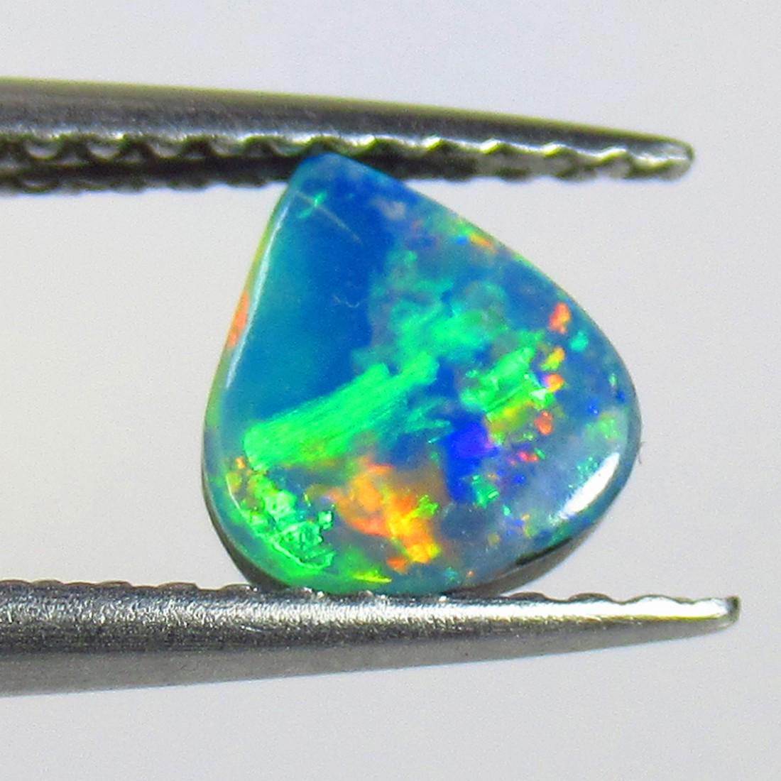 0.91 Ctw Natural Australian Opal Trillion Cabochon: No Reserve! Title: 0.91 Ctw Natural Australian Opal Trillion Cabochon Stone Clarity: Opaque Gemstone: Australian Opal Carat Weights: 0.91 Size/ Dimensions: 6.50 x 6.00 x 3.10 mm Additional Info: Nice