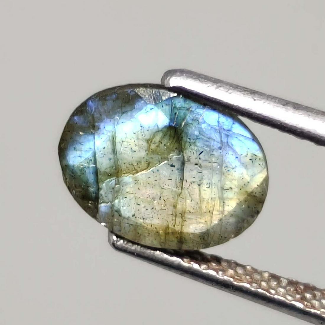 1.45 ct Natural Faceted Labradorite: No Reserve! Title: 1.45 ct Natural Faceted Labradorite Additional Info: Gemstones: Labradorite Carat Weights: 1.45 ct Size/Dimensions: 9 X 7 mm Origin : Labrador Materials: Labradorite Weight Unit: Ct
