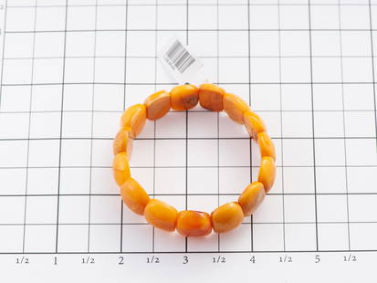 Natural baltic amber bracelet: Title: Natural baltic amber bracelet Materials: Baltic amber Weight: 13.77 Additional Information: Genuine Baltic Butterscotch amber bracelet. Polished tablet shape with side drilling. Bracelet fits