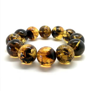 Baltic amber cut beads bracelet with inclusions: Title: Baltic amber cut beads bracelet with inclusions Metal: None Gemstones: Amber Weight: 25.3 g Size: Bead size: 15.0 mm Bead size: 0.591 inches Made of: Whole Stone Additional Information: