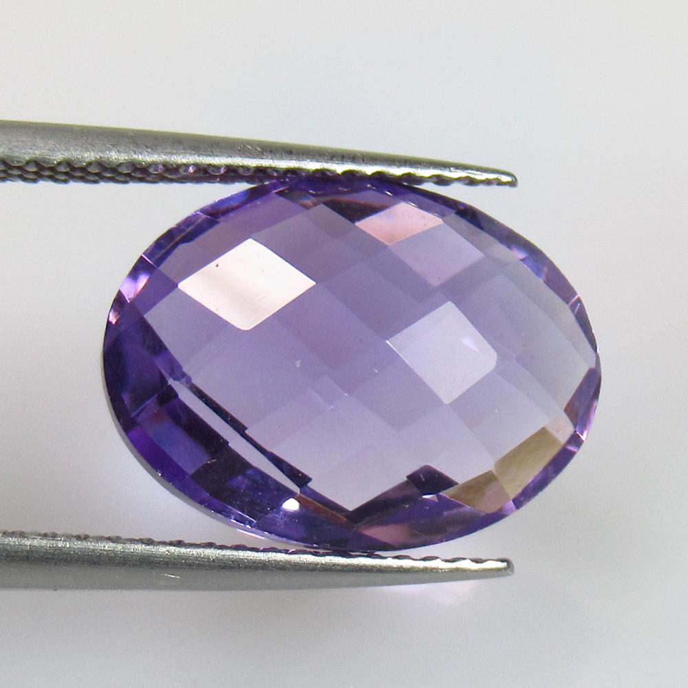 7.30 Ctw Natural Purple Amethyst Oval Checkerboard Cut: No Reserve! Title: 7.30 Ctw Natural Purple Amethyst Oval Checkerboard Cut Stone Clarity: VVS Gemstones: Amethyst Carat Weights: 7.3 Size/Dimensions: 14.40 x 11.00 x 7.30 mm Additional Information: Exc