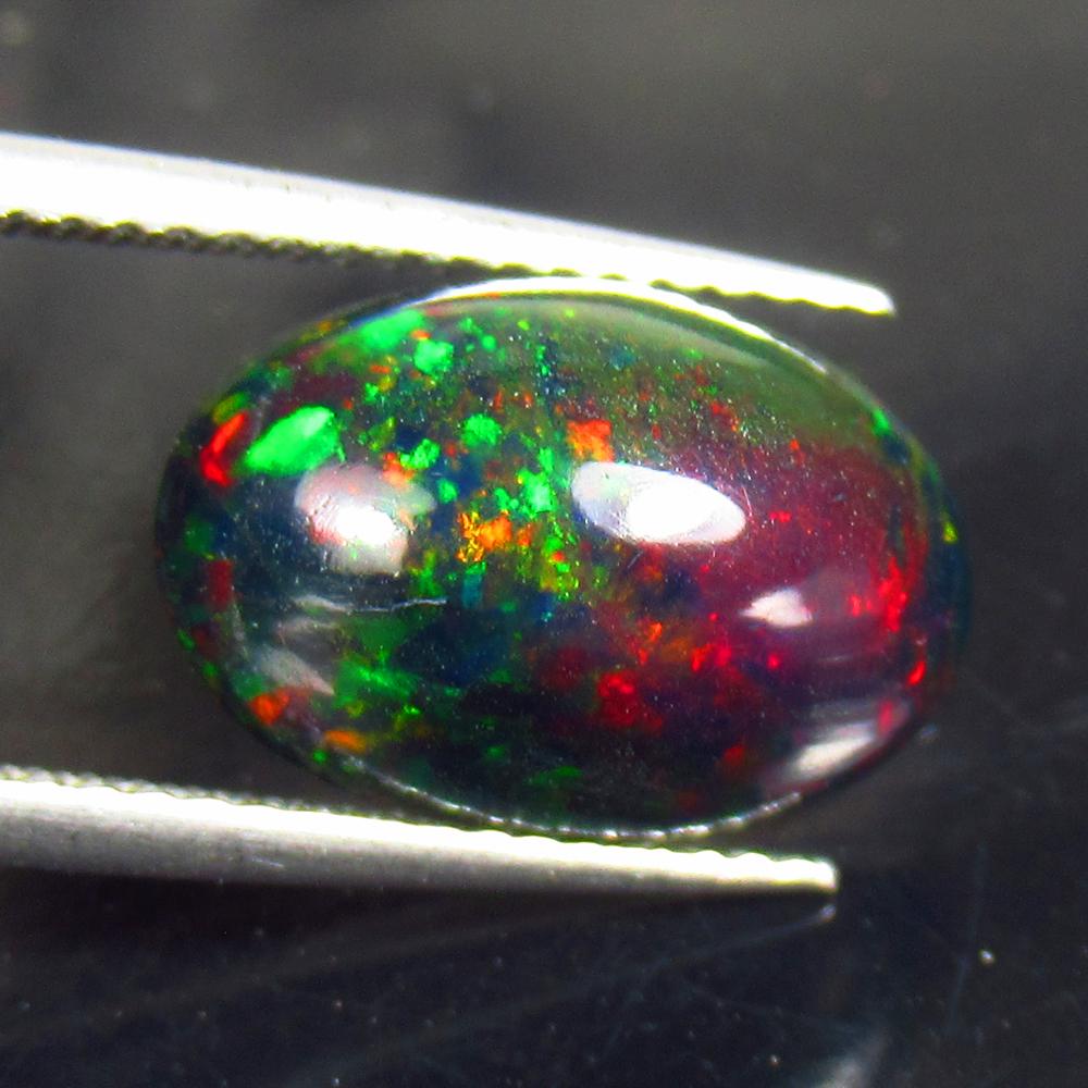 3.73 Ctw Natural Ethiopian Black Fire Opal Oval Cab: No Reserve! Title: 3.73 Ctw Natural Ethiopian Black Fire Opal Oval Cab Stone Clarity: Translucent Gemstones: Black Opal Carat Weights: 3.73 Size/Dimensions: 13.80 x 9.40 x 6.20 mm Additional Informati