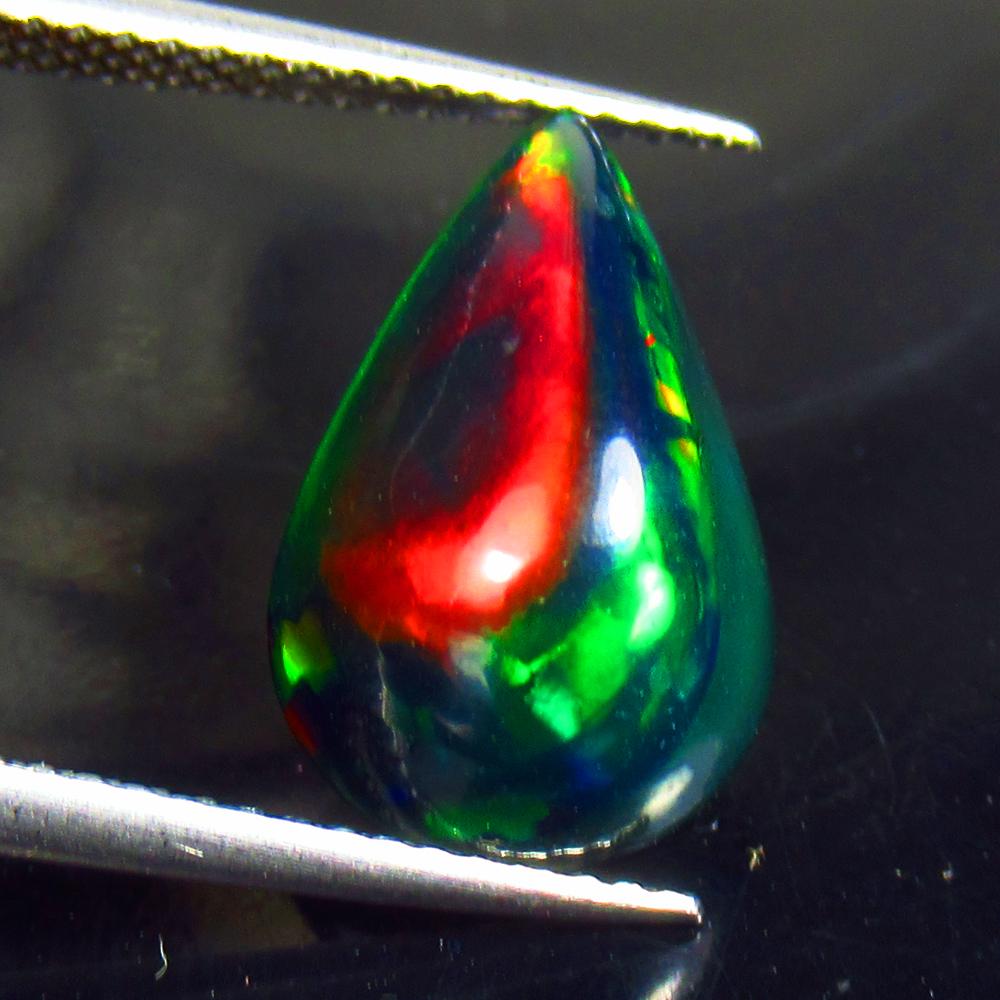 3.60 Ctw Natural Ethiopian Black Fire Opal Pear Cab: No Reserve! Title: 3.60 Ctw Natural Ethiopian Black Fire Opal Pear Cab Stone Clarity: Translucent Gemstones: Black Opal Carat Weights: 3.6 Size/Dimensions: 15.60 x 9.80 x 6.60 mm Additional Informatio
