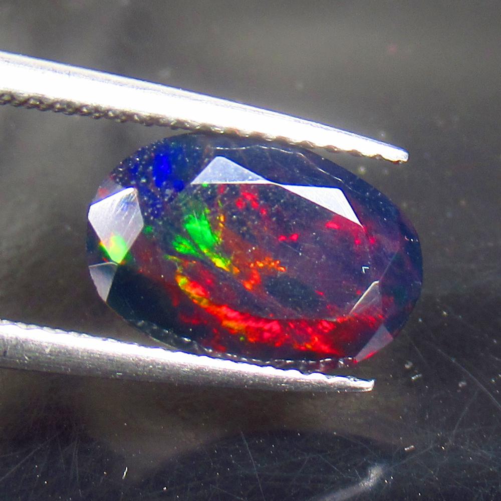 1.50 Ctw Natural Ethiopian Black Fire Opal Oval Cut: No Reserve! Title: 1.50 Ctw Natural Ethiopian Black Fire Opal Oval Cut Stone Clarity: Translucent Gemstones: Black Opal Carat Weights: 1.5 Size/Dimensions: 11.60 x 7.60 x 4.00 mm Additional Informatio