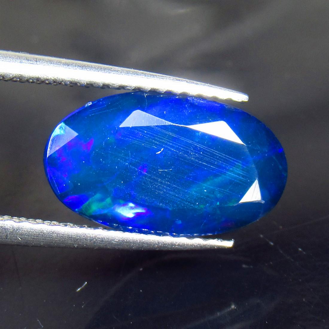 2.30 Ctw Natural Ethiopian Black Fire Opal Oval Cut: No Reserve! Title: 2.30 Ctw Natural Ethiopian Black Fire Opal Oval Cut Stone Clarity: Translucent Gemstone: Black Opal Carat Weights: 2.3 Size/ Dimensions: 13.50 x 7.80 x 5.20 mm Additional Info: Exce