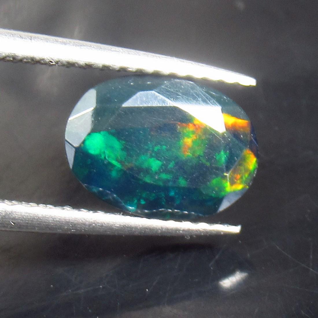 1.18 Ctw Natural Ethiopian Black Fire Opal Oval Cut: No Reserve! Title: 1.18 Ctw Natural Ethiopian Black Fire Opal Oval Cut Stone Clarity: Translucent Gemstones: Natural Black Opal Carat Weights: 1.18 Size/Dimensions: 10.10 x 7.30 x 4.00 mm Additional I