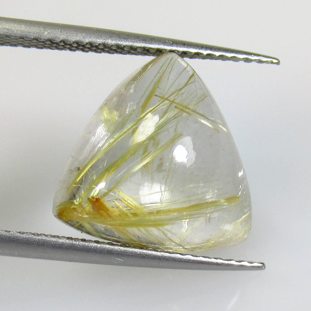 8.15 Ctw Natural Golden Rutile Quartz Trillion Cab: No Reserve! Title: 8.15 Ctw Natural Golden Rutile Quartz Trillion Cab Stone Clarity: Transparent Gemstones: Rutile Quartz Carat Weights: 6.85 Size/Dimensions: 18.20 x 10.70 x 6.70 mm Additional Inform