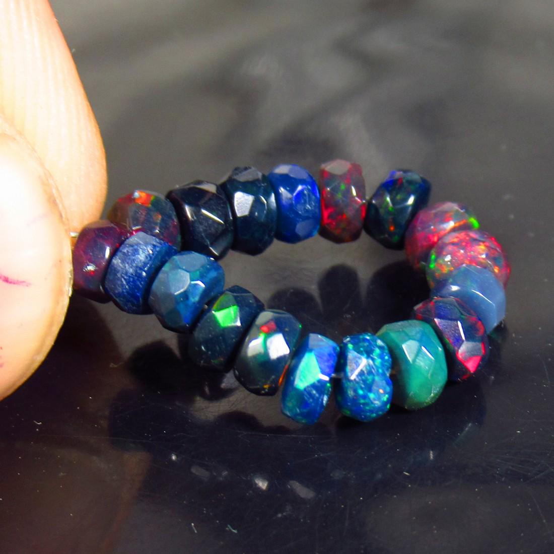 4.26 Ctw Natural 18 Drilled Faceted Black Opal Beads: No Reserve! Title: 4.26 Ctw Natural 18 Drilled Faceted Black Opal Beads Stone Clarity: Translucent Gemstone: Faceted Black Opal Beads Carat Weights: 4.26 Size/ Dimensions: 3.70 to 4.50 mm / 18 PC's