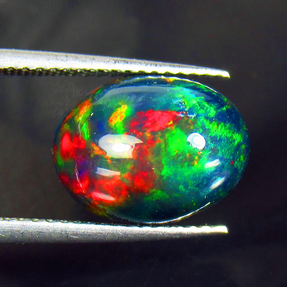 4.18 Ctw Natural Black Fire Opal Oval Cabochon: Title: 4.18 Ctw Natural Black Fire Opal Oval Cabochon Stone Clarity: Opaque Gemstone: Natural Opal Carat Weight: 4.18 Size/Dimensions: 12.60 x 9.60 x 7.40 mm Additional Information: Shape - Oval Caboc
