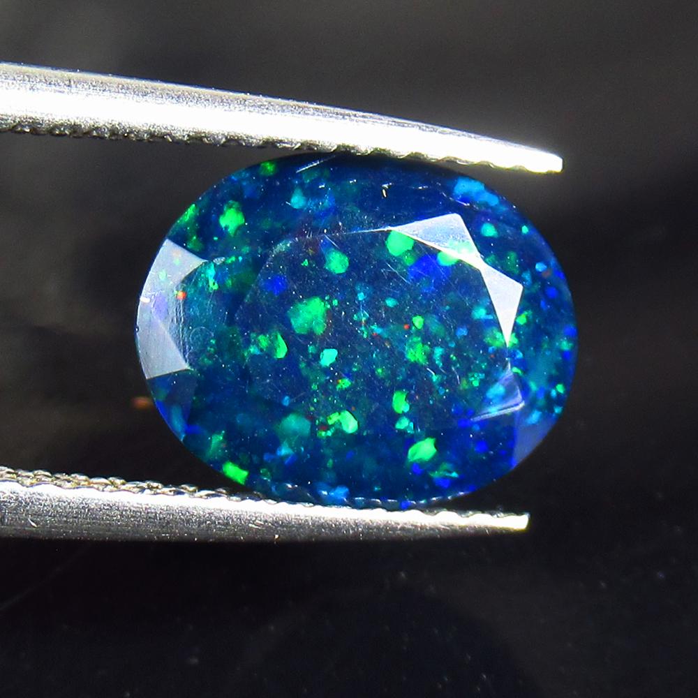 2.07 Ctw Natural Black Fire Opal Oval Cut: Title: 2.07 Ctw Natural Black Fire Opal Oval Cut Stone Clarity: Translucent Gemstone: Natural Opal Carat Weight: 2.07 Size/Dimensions: 10.60 x 8.30 x 5.60 mm Additional Information: Shape - Oval Cut /