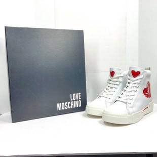 Love Moschino White Vegan Leather High Tops: New in box Love Moschino White vegan leather high tops Size 39 Rubber soles Lace up closure Heel 1" Shaft 3" Width 3" Reserve: $200.00 Shipping:Domestic: Flat-rate of $15.00 to anywhere within the