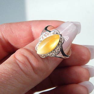 Genuine Lemone Yellow Baltic Amber Marquise Cut Ring in 925 Silver: New with tags Ombre yellow baltic amber set in sterling silver Amber goes from a light sunny yellow to a lemon yellow Marquise cut set in 925 sterling silver with metal designs flanking each side of