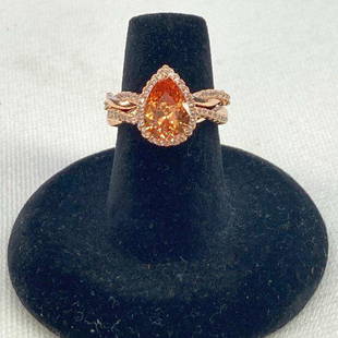 18K Rose Gold Plated Citrine Cubic Zirconia Double Band Ring: New without tags 18KT rose gold plated brass ring All stones are zircon Citrine pear cut gemstone surrounded by small white zircon jewels Second ring has small white zircon jewels Reserve: $12.00 