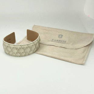 Tardini White Python Cuff: Pre-owned New without tags Tardini ivory and gold cuff bracelet 100% Python Width 3" but is adjustable Height 1" Some scales are slightly bent Reserve: $30.00 Shipping:Domestic: Flat-rate of $6.00
