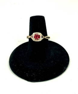10K Solid Yellow Gold Rhodalite in Diamond Halo Ring: Title: 10K Solid Yellow Gold Rhodalite in Diamond Halo RingSize: 7.25Additional Information: New without tags 10K yellow gold rhodolite and diamond halo ring Size 7.25 Clarity of gemstone is