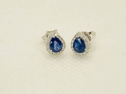 18K Solid White Gold Sapphire and Diamond Halo Earrings: Title: 18K Solid White Gold Sapphire and Diamond Halo EarringsSize: One SizeAdditional Information: New with tags 18K white gold sapphire and diamond halo earrings Total weight 1.03g 2 Blue sapphires