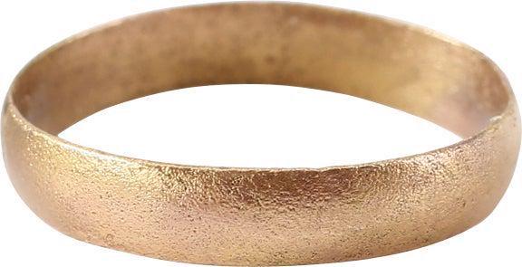 VIKING WOMAN’S WEDDING RING, 900-1050 AD 5 1/2: Size 5 1/2. Rounded band, 3.3mm. Sized in its working life. Vikings exchanged rings on the pommel of the groom's sword. Professionally refurbished with the surface restored in 24 karat gold. Good wear