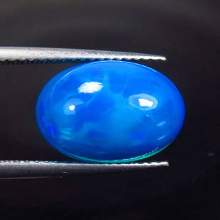 3.63 Ctw Natural Ethiopian Blue Fire Opal Oval Cab: Title: 3.63 Ctw Natural Ethiopian Blue Fire Opal Oval Cab Stone Clarity: Translucent Gemstones: Natural Blue Opal Carat Weights: 3.63 Size/Dimensions: 13.60 x 9.40 x 6.50 mm Additional Information: