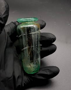 ANCIENT ROMAN MEDICAL GLASS VIAL: Title: ANCIENT ROMAN MEDICAL GLASS VIALDimensions: Ca.100 AD. A beautiful pale-blue clear glass medical vial; unique shape, rare example; ;From a private London Collection formed in the 1970's; all