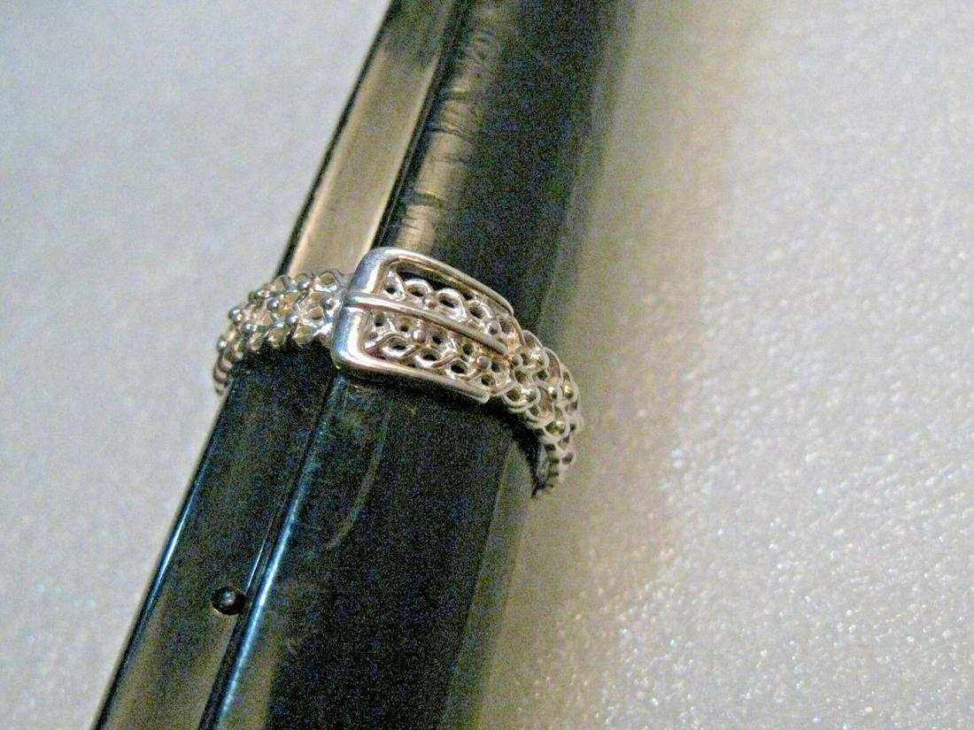 Vintage Sterling Silver Belt Ring/ Wedding Band, Unisex, Size 11, 3.40 gr: Vintage Sterling Silver Belt ring - size 11, 3.40 grams. Unisex - The buckle is a smooth finish and the belt is a textured mesh design or filigree. It is 8mm wide at the buckle and tapers down to 5mm
