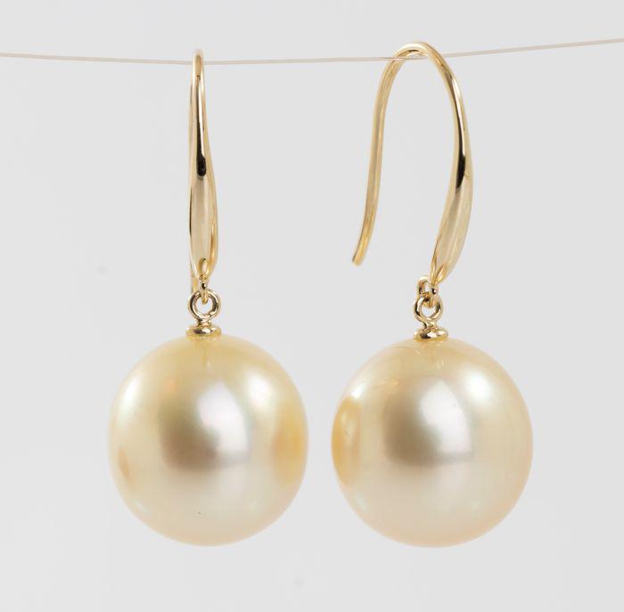 14 kt. Yellow Gold - 11x12m Golden South Sea Pearls - Earrings: Title: 14 kt. Yellow Gold - 11x12m Golden South Sea Pearls - Earrings Description: Produced by the gold-lipped Pinctada Maxima Oyster in the warm waters off the coasts of Australia, these pearls have 