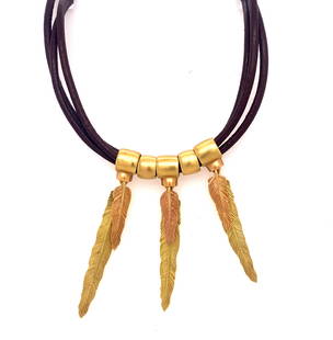 H. Stern Purangaw Collection Two Color Gold Feather 18K Leather Necklace: This is a stunning necklace by H. Stern from the Purangow collection inspired by Amazon tribes. The necklace has a design with two color gold feathers layered on top of each with attached to a three
