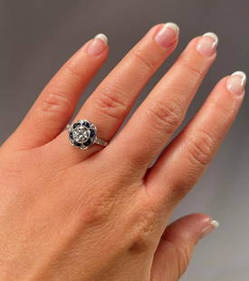 Beautiful Vintage Art Deco Design Platinum Diamonds Sapphire Ring: Beautiful Vintage Art Deco Design Platinum Diamonds Sapphires Ring. The center diamond is a brilliant firey old European cut weighing .73 carats. There are 3 diamonds on each shoulder of the ring and