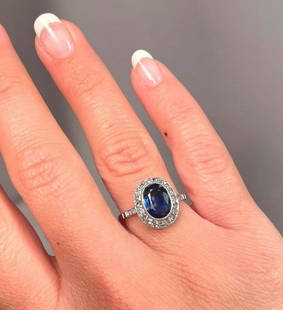 Superb Art Deco Oval Cut 1.90 Carat Gem Sapphire Diamonds Halo Platinum Ring: Beautiful Art Deco Oval Cut 1.90 Carat Gem Sapphire Diamonds Halo Platinum Ring. The color of the sapphire is beautiful and it has great clarity. The ring size is 7-1/4. Sapphires of this high