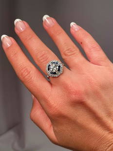 Beautiful Vintage 1.25 Carat Center Diamond Plus Sapphires Diamonds Halo Ring: Beautiful Vintage Art Deco 1.25 Carat Center Diamond Plus Sapphires Diamonds Halo Platinum Ring. The center diamond is an old mine cut J color SI 1 clarity. The face of the ring measures 14 mm wide.