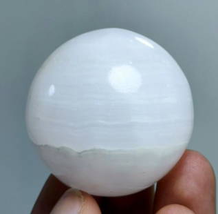 95 Gram Natural Calcite Healing Sphere: 95 Gram Natural Calcite Healing SphereOrigin: PakistanGemstone Type: NaturalCarat Weights: 95 GramSize/Dimensions: 41 mm Reserve: $20.00 Shipping:Domestic: Flat-rate of $15.00 to anywhere within