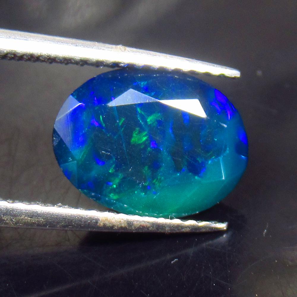 1.70 Ctw Natural Ethiopian Black Fire Opal Oval Cut: No Reserve! Title: 1.70 Ctw Natural Ethiopian Black Fire Opal Oval Cut Stone Clarity: Translucent Gemstones: Natural Black Opal Carat Weights: 1.7 Size/Dimensions: 10.80 x 8.20 x 4.90 mm Additional In