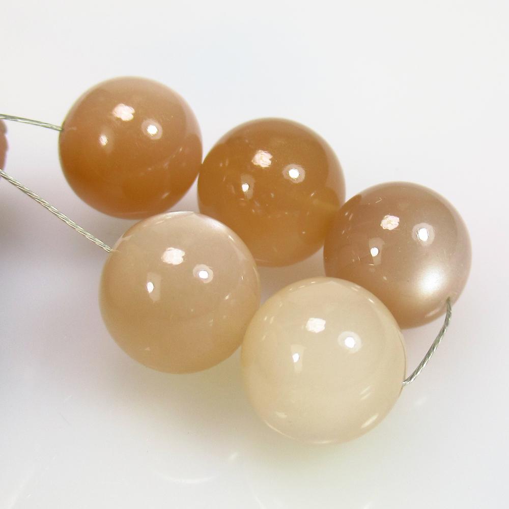 29.62 Ctw Natural 5 Drilled Moonstone Round Ball Beads: No Reserve! Title: 29.62 Ctw Natural 5 Drilled Moonstone Round Ball Beads Stone Clarity: Semi-Transparent Gemstones: Natural Moonstone Beads Carat Weights: 29.62 Size/Dimensions: 9.40 - 10.20 mm / 5 P