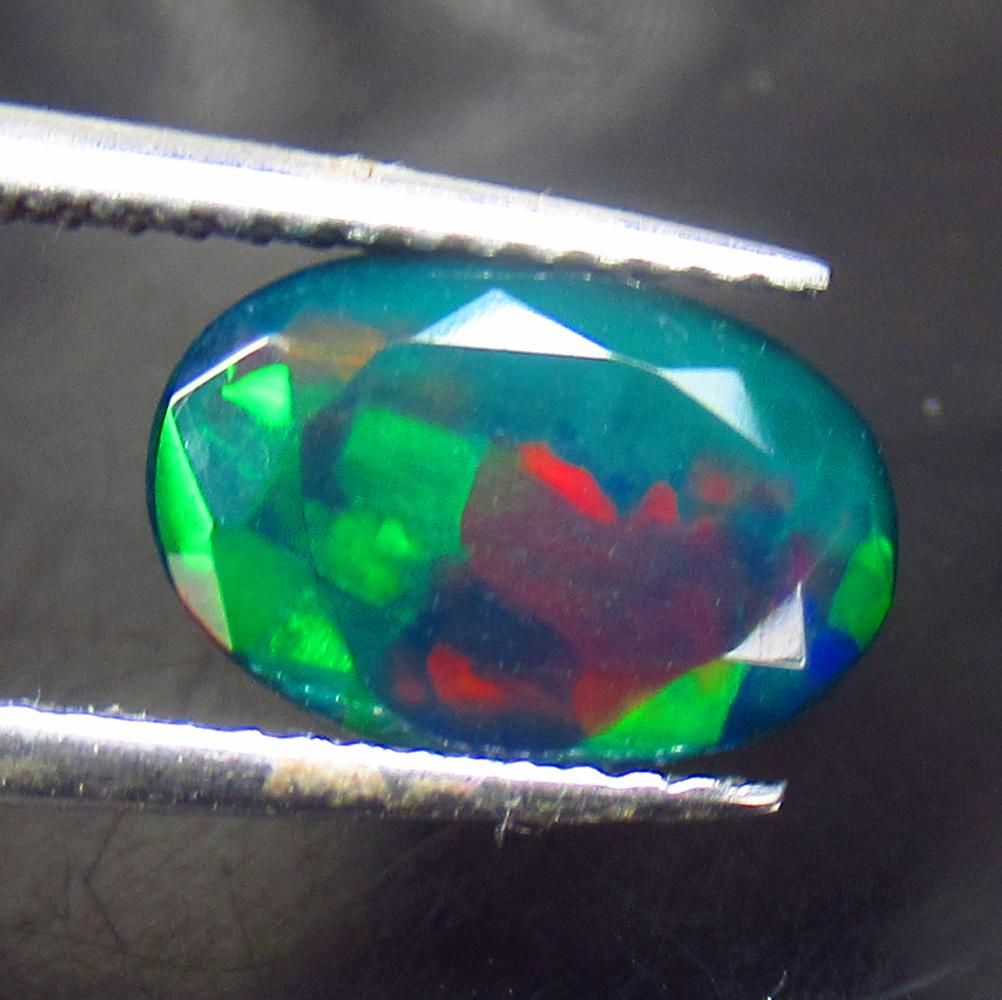 1.60 Ctw Natural Ethiopian Black Fire Opal Oval Cut: No Reserve! Title: 1.60 Ctw Natural Ethiopian Black Fire Opal Oval Cut Stone Clarity: Translucent Gemstones: Natural Black Opal Carat Weights: 1.6 Size/Dimensions: 10.50 x 7.10 x 5.10 mm Additional In