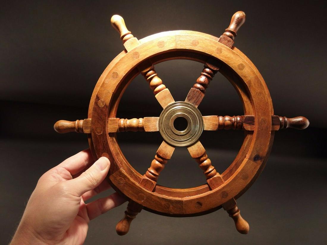 Wood Nautical Ships Helm Steering Wheel: Description 13" wide Very accurate and well made reproduction of an antique ships wheel. Handmade from hardwood and brass. Slightly aged to look old. Certainly easy to wonder its age Reserve: $30.00 S