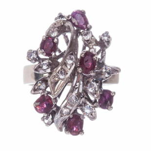 Art Deco Sterling Silver Ruby White Sapphire Cocktail Ring: Gorgeous cocktail ring. Circa 1940's to 1950's. Sterling silver, natural oval rubies, and round white sapphires. Top measures 24 mm's by 18 mm's. Depth of ring is 16 mm's from highest set stone